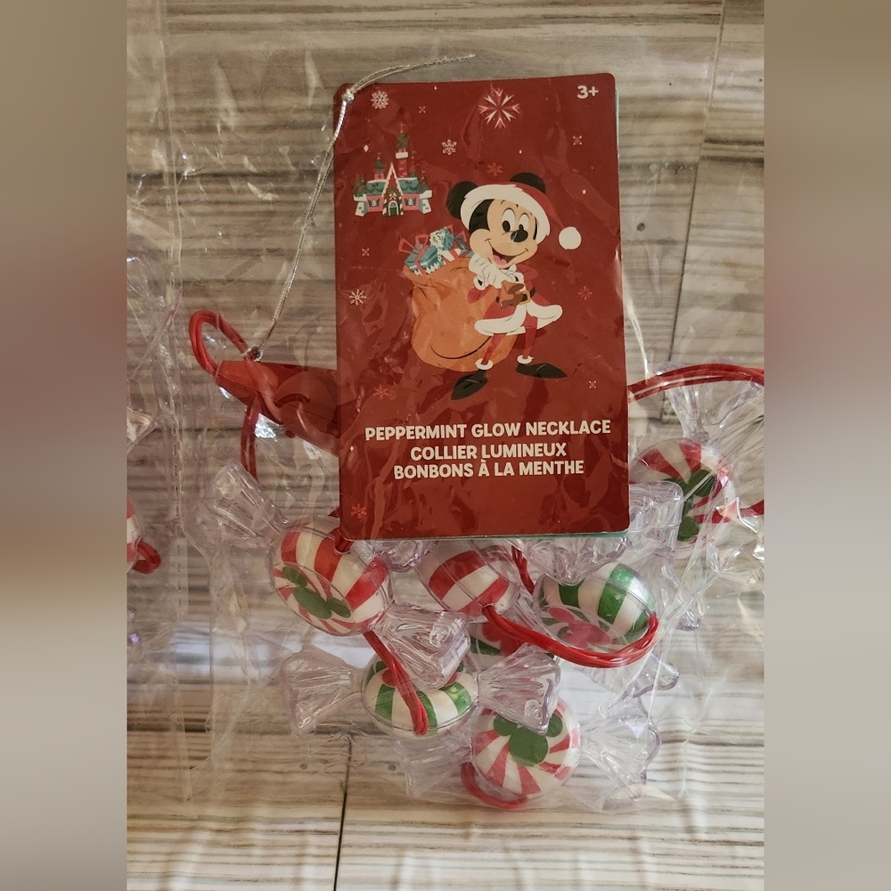 Two Disneyland peppermint glow necklace